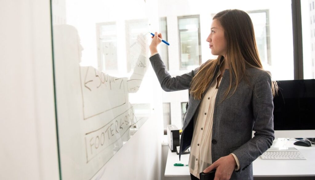 Woman at whiteboard