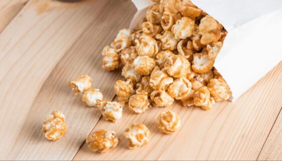 Popcorn in bag on table.