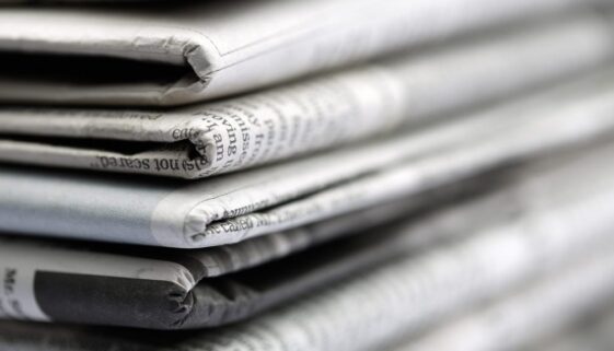 Newspapers folded and stacked concept