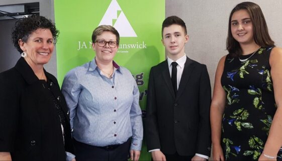 JANBs Connie Woodside and Haley Bungay with students Tyler Travis and Allison Orr.