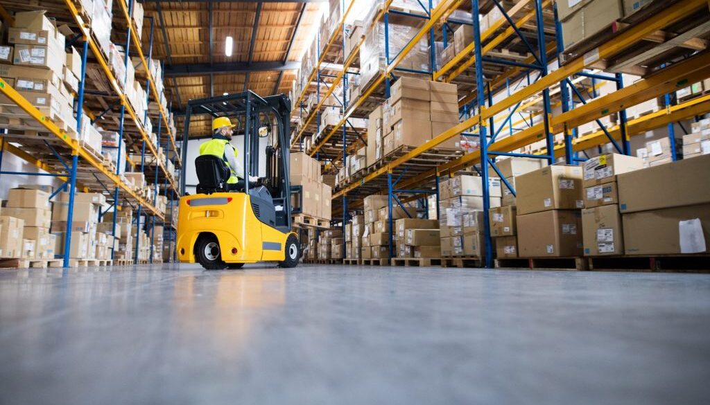 Warehouse man worker with forklift.