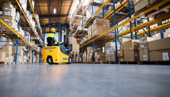 Warehouse man worker with forklift.