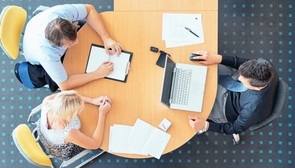 Couple Signing the Sales Contract