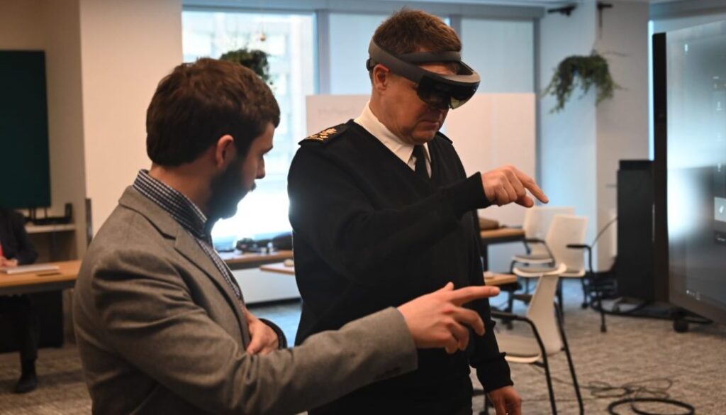 Vice-Admiral Lloyd receiving a Kognitiv Spark demo