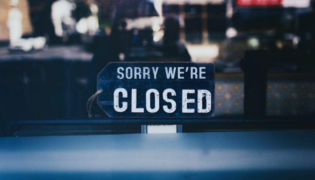 close-up-photo-of-sorry-we-re-closed-sign-on-glass-window-2467649