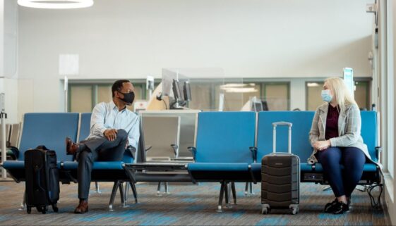 two pax talking with masks on