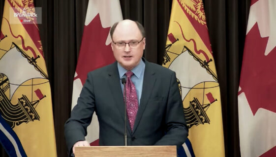 Post-Secondary Education, Training and Labour Minister Trevor Holder speaks on Dec 2, 2021. (Image YouTube video capture)