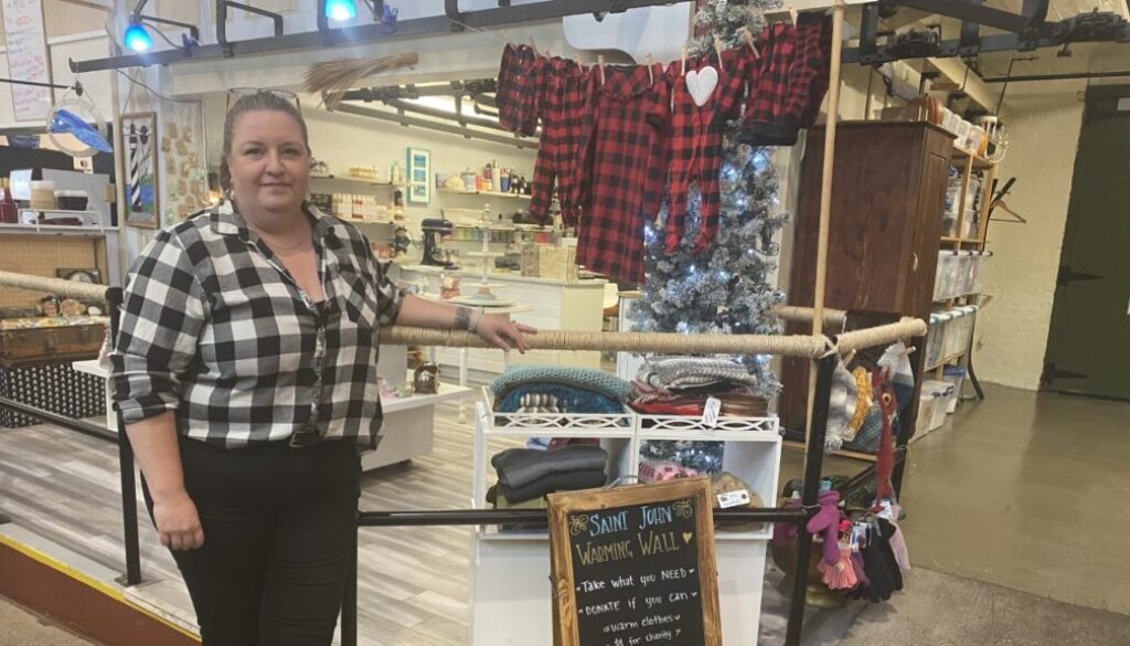 Jill Laskey, who owns The Blue Pelican Bath & Body, launched the Warming Wall outside her Saint John City Market stall. Image Brad Perry