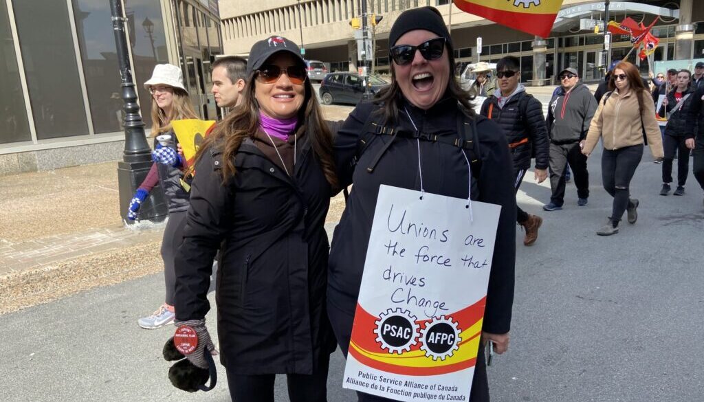 Picketers pose during a rally at Halifaxs Grand Parade Square on April 26, 2023. Staff photo