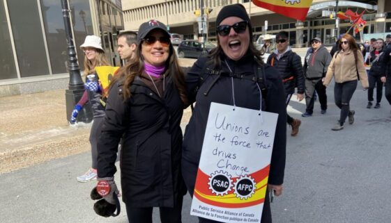 Picketers pose during a rally at Halifaxs Grand Parade Square on April 26, 2023. Staff photo